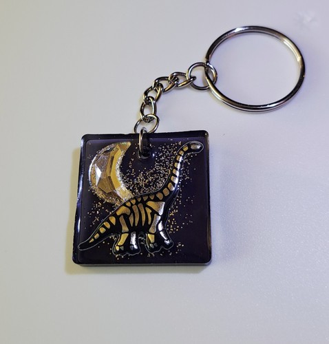 Dinosaur keyring with moon